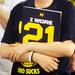 A fan holds a copy of Desmond Howard's new book  ?I Wore 21: The Legend of Desmond Howard? while waiting in line for an autograph signing with the football star at the M Den on Friday.  Melanie Maxwell I AnnArbor.com